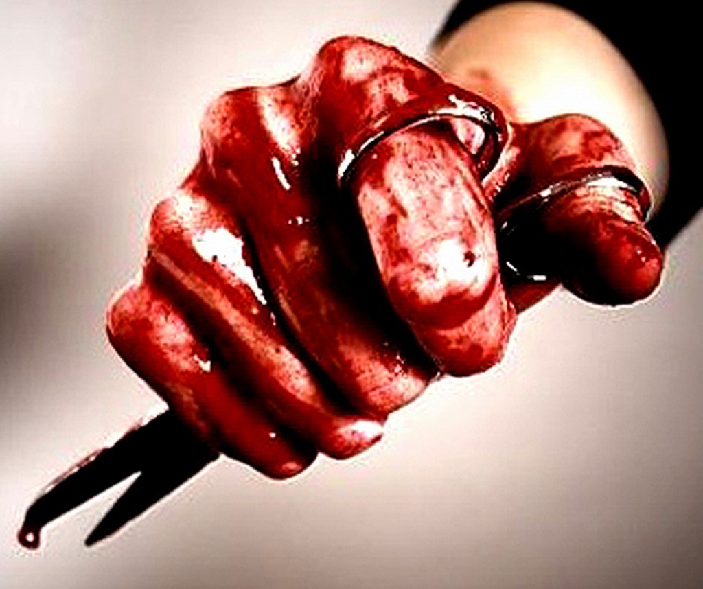 bloody hand with scissors