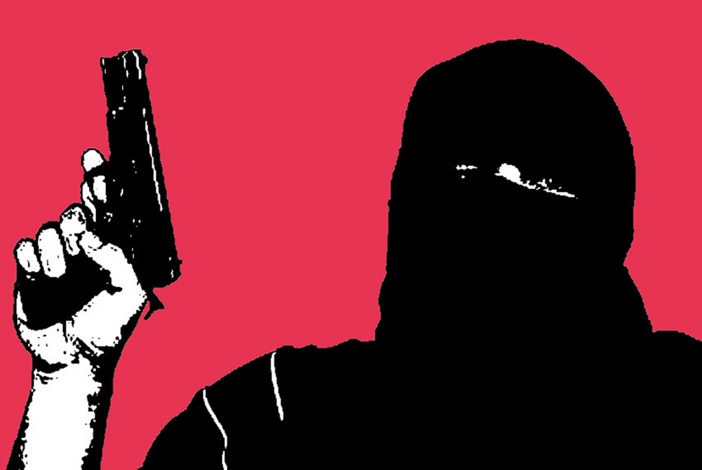 Terrorist man holding 9mm semiautomatic gun and hiding face