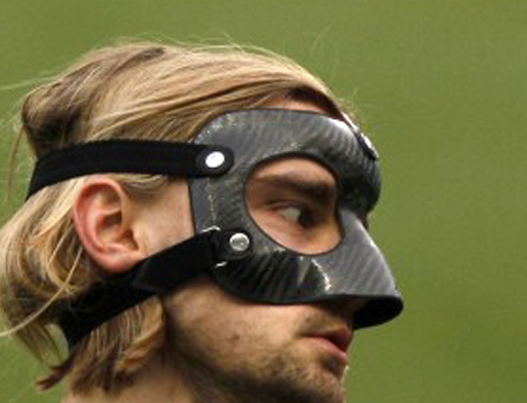 Marcel-Schmelzer-of-German-soccer-team-Borussia-Dortmund-wears-a-protective-mask-during-a-training-session-at-La-Rosaleda-stadium-in-Malaga-southern-Spain-on-April-2-2013.-ReutersJon-Nazca-650x426
