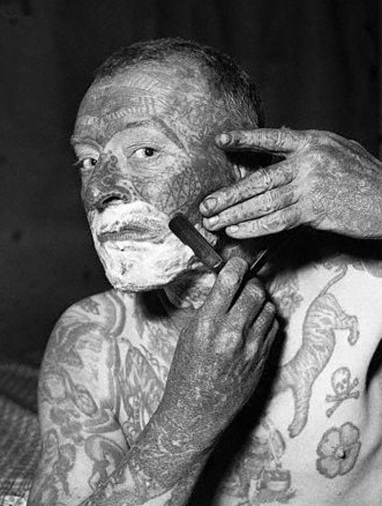 Tattooed Man Shaving