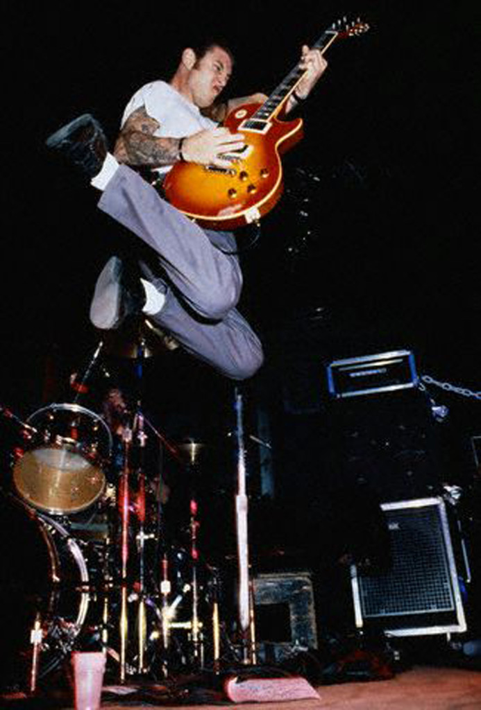 Mike Ness of Social Distortion Jumping in Air