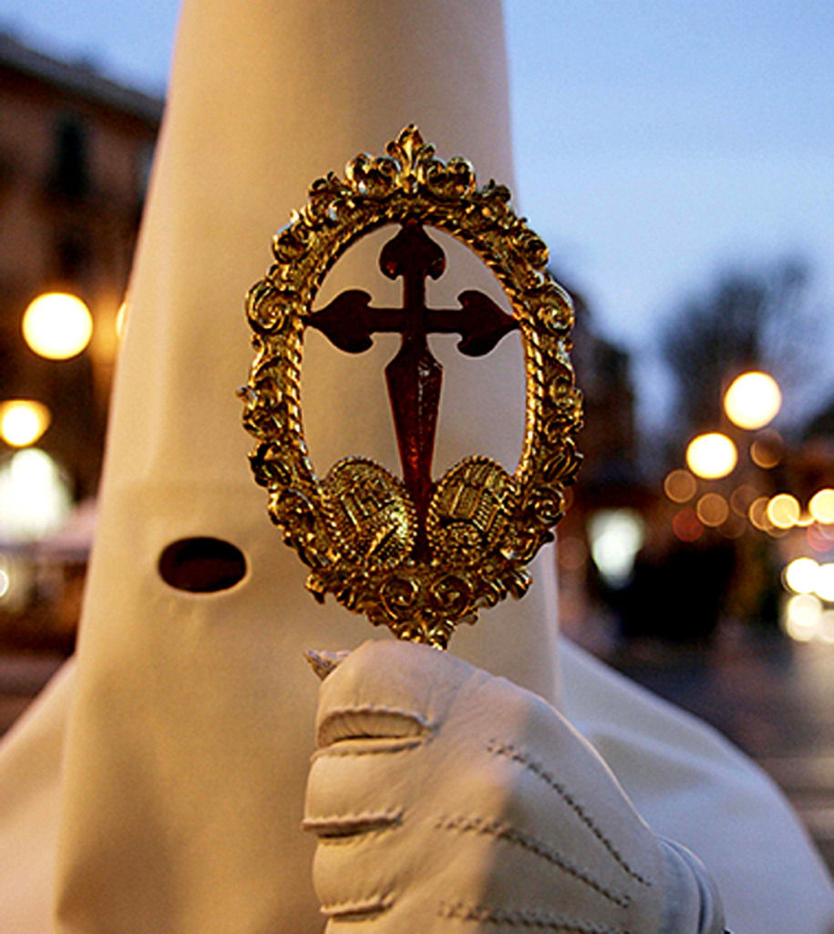 A penitent takes part in the procession of the 'Virgen Dolorosa' during a Holy Week in Mallorca