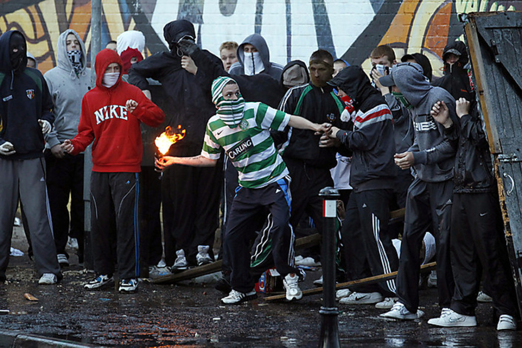 A Nationalist youth throws a petrol bomb at Police in the Ardoyne area, north Belfast
