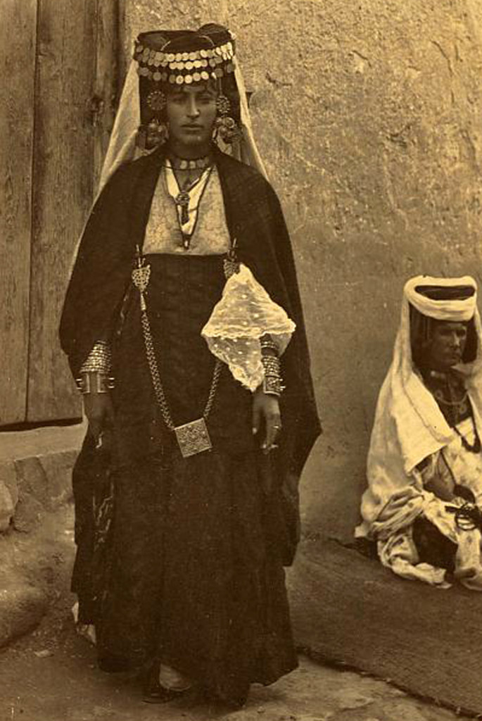 woman_wearing_elaborate_headress_bracelets_and_other_jewelry_on_the_road_to_ouled_nails._biskra_algeria._1860-1890