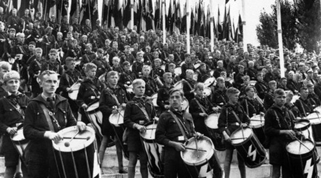 16 Sep 1935, Nuremberg, Germany --- Members of the Hitler youth drumming during a march past at Nuremburg when 100,000 Nazis were reviewed by the German Chancellor Adolf Hitler. --- Image by © Hulton-Deutsch Collection/CORBIS