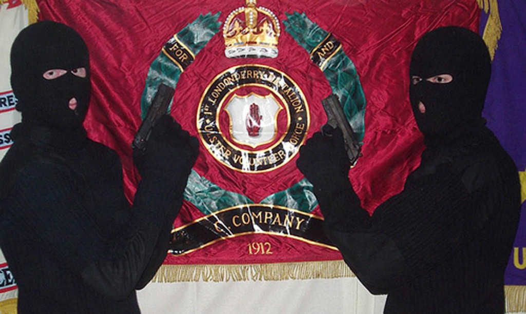 in-ireland-gunmen-of-the-uvf-a-british-terrorist-organisation-pose-in-front-of-an-extremist-flag