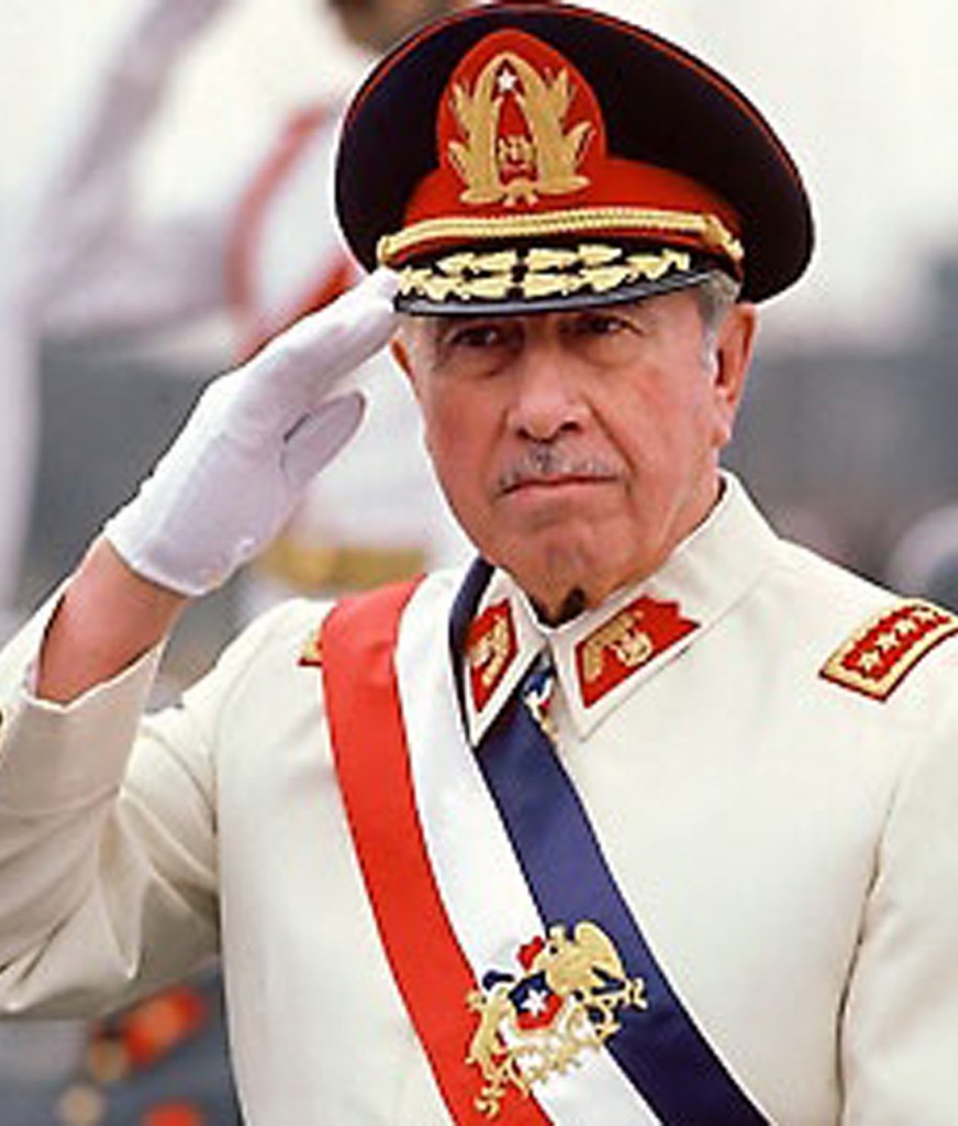 President Augusto Pinochet, saluting, on Armed Forces Day. (Photo by Robert Nickelsberg//Time Life Pictures/Getty Images)