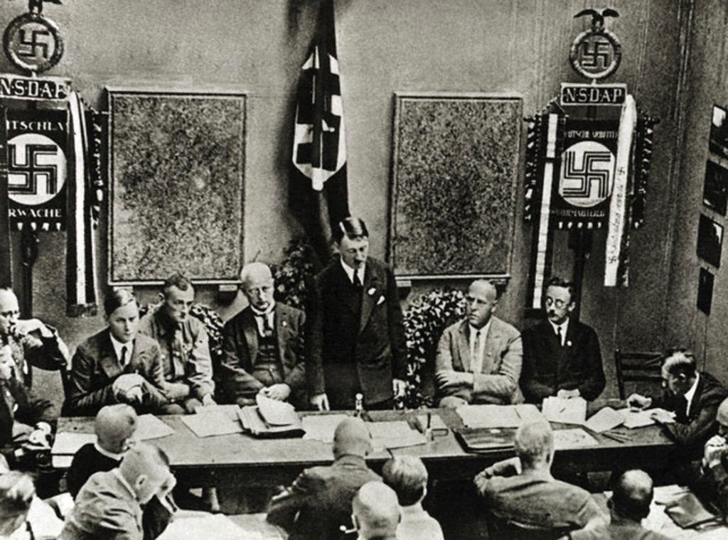 Munich, Germany --- Original caption: Founding of the Nazi Party in Munich, 1925. From left: Rosenberg, Buch, Schwarz, Hitler, Gregor Strasser, Himmler. Lower right: Julius Streicher. Photograph. --- Image by © Bettmann/CORBIS