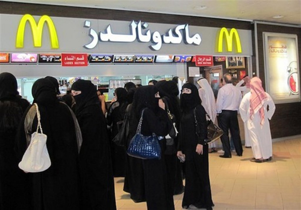 Men and women wait in separate lines to order at McDonald's in Riyadh's Faisaliah mall May 16, 2012. REUTERS/Arlene Getz