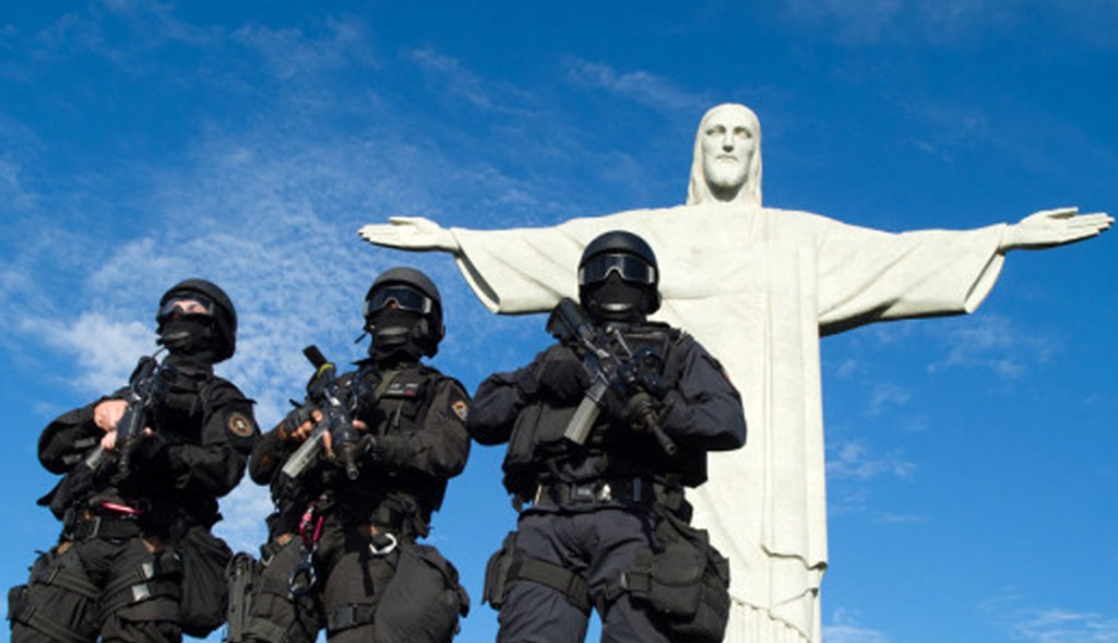 Members of the Elite Unit of the Brazilian Military Police (BOPE) practice maneuvers in front of the Christ the Reedemer statue on Corcovado Hill in Rio de Janeiro, Brazil, on April 6, 2013. Rio de Janeiro will host matches of the FIFA Confederation Cup in June and the 2013 World Youth Day international Catholic gathering in July. AFP PHOTO / CHRISTOPHE SIMONCHRISTOPHE SIMON/AFP/Getty Images